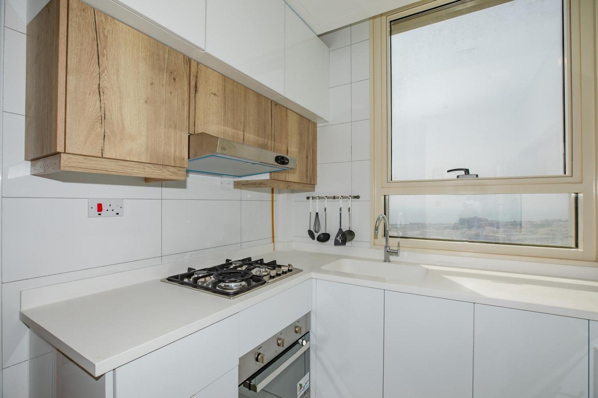 Platinum Coast Hotel Apartments Al Fujayrah Quarto foto A modern kitchen